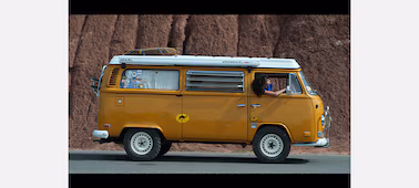 Example image of a campervan driving along the road
